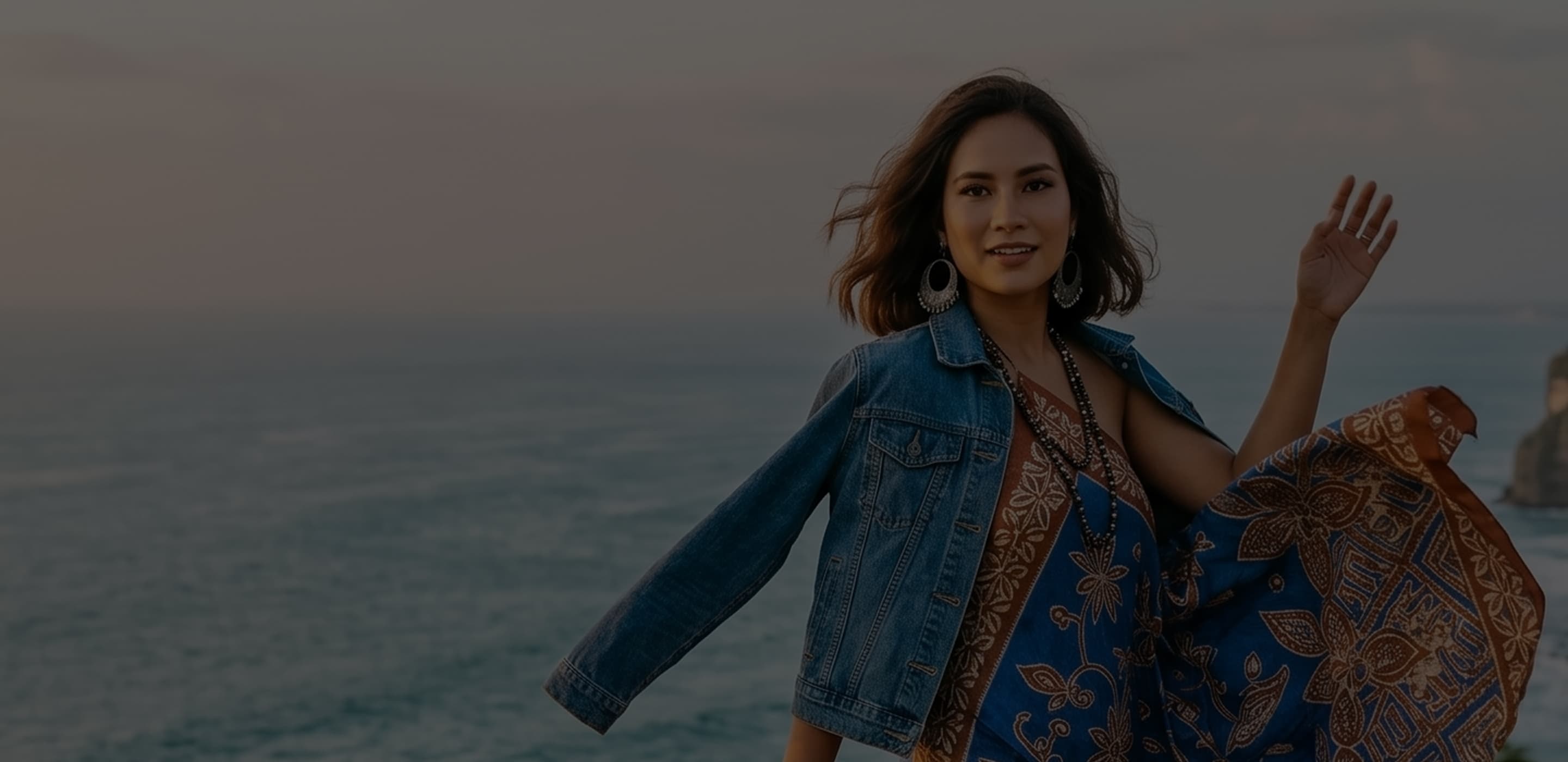 Talent posing on a beach at sunset